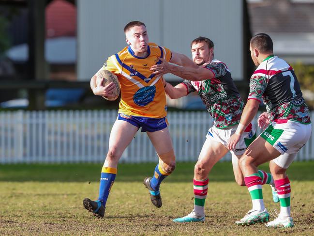 Dolphins fullback Harrison Marsh takes on Cooper Stevens and Connor Higgins. Picture: Adam Wrightson Photography