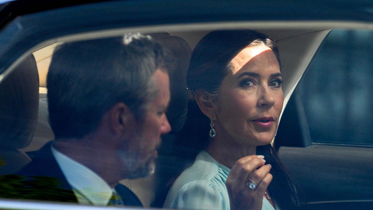 King Frederik X of Denmark (L) and Queen Mary of Denmark (R) are seen on a car on the way to meet Norway's Prime Minister at the commander's residence at Akershus fortress in Oslo, Norway, on May 15, 2024, during the Danish royal couple's official state visit to Norway. (Photo by Javad Parsa / NTB / AFP) / Norway OUT