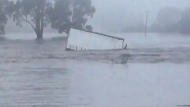 A Mercury delivery truck is swept away