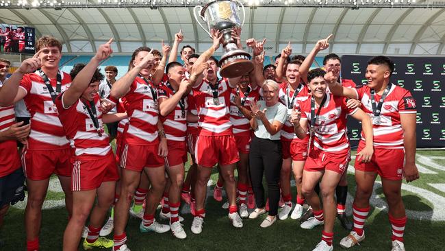 NRL National Schoolboys Cup final at CBUS Stadium between Palm Beach Currumbin and Patrician Blacktown Brothers. The Red Army and Palm Beach Currumbin players celebrate the win. .Picture Glenn Hampson