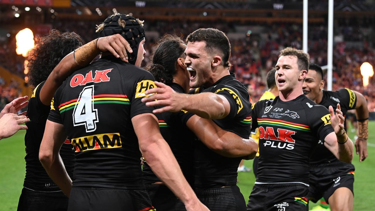BRISBANE, AUSTRALIA - OCTOBER 03: Nathan Cleary of the Panthers celebrates with Matt Burton of the Panthers after he scored a try during the 2021 NRL Grand Final match between the Penrith Panthers and the South Sydney Rabbitohs at Suncorp Stadium on October 03, 2021, in Brisbane, Australia. (Photo by Bradley Kanaris/Getty Images)