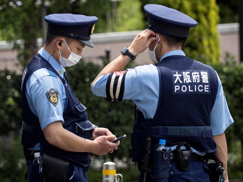 Police officers patrol near the Olympic Village. Picture: AFP