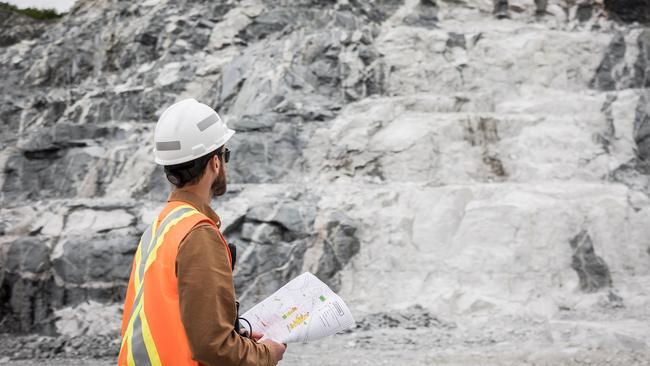 An employee of Sayona Quebec in front of a lithium deposit at the company's North American Lithium Complex in La Corne.