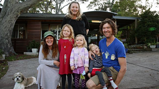 Ina Mills and David Mills with their children Ruby (6), Rosie (2) and Roki (5) as well as the old home owner Sue Cowper (black top) at their new home in Newport. Picture: Adam Yip / Manly Daily