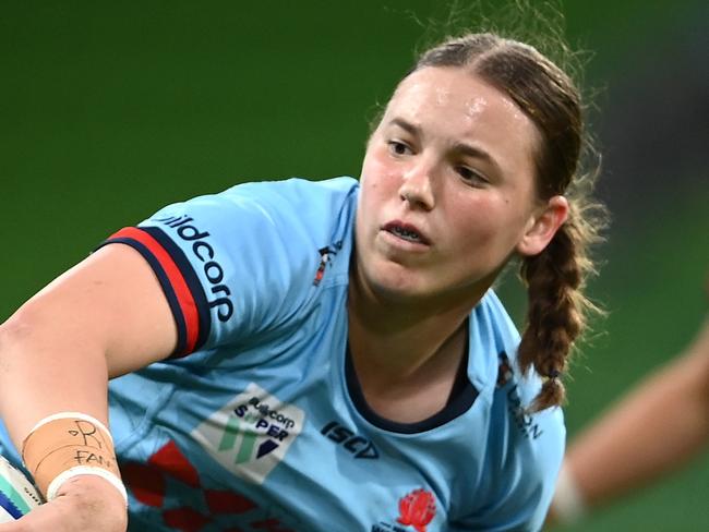 MELBOURNE, AUSTRALIA - APRIL 21: Caitlyn Halse of the Waratahs passes the ball during the Super W match between Melbourne Rebels Women and NSW Waratahs Women at AAMI Park, on April 21, 2023, in Melbourne, Australia. (Photo by Quinn Rooney/Getty Images)