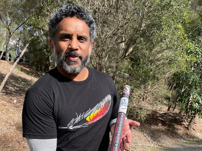 Preston Campbell with Alberton Ormeau's Aboriginal artwork middle stump, designed by himself.