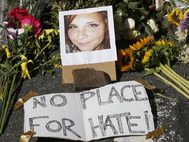 A makeshift memorial of flowers and a photo of Heather Heyer who was killed when a car rammed into a group of people who were protesting the presence of white supremacists who had gathered in the city for a rally. Picture: Steve Helber/AP