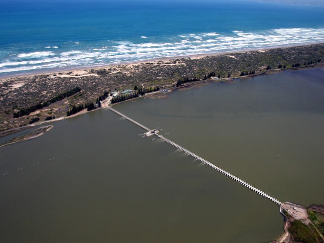 Aerials of Goolwa the last town on Murray River. Water flowing through the Goolwa barrages.