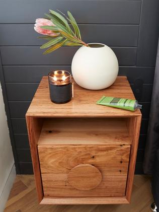 They kept the wooden theme going with this bedside table.