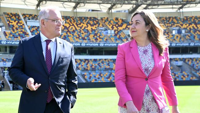 BRISBANE, AUSTRALIA - NewsWire Photos - MARCH 21, 2022.(L to R) Brisbane Lord Mayor Adrian Schrinner, Prime Minister Scott Morrison and Queensland Premier Annastacia Palaszczuk visit he Gabba Stadium in Brisbane to announce the SEQ City Deal.Picture: NCA NewsWire / Dan Peled