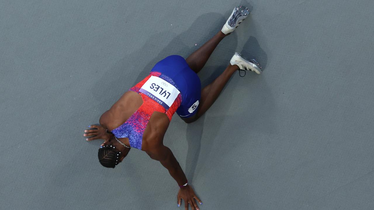 PARIS, FRANCE - AUGUST 08: (EDITORS NOTE: Image was captured using a robotic camera positioned above the field of play.) Bronze medalist Noah Lyles of Team United States reacts after competing in the Men's 200m Final on day thirteen of the Olympic Games Paris 2024 at Stade de France on August 08, 2024 in Paris, France. (Photo by Richard Heathcote/Getty Images)