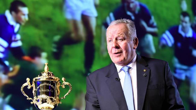 World Rugby chairman Bill Beaumont speaks beside the Webb Ellis Cup in Tokyo.