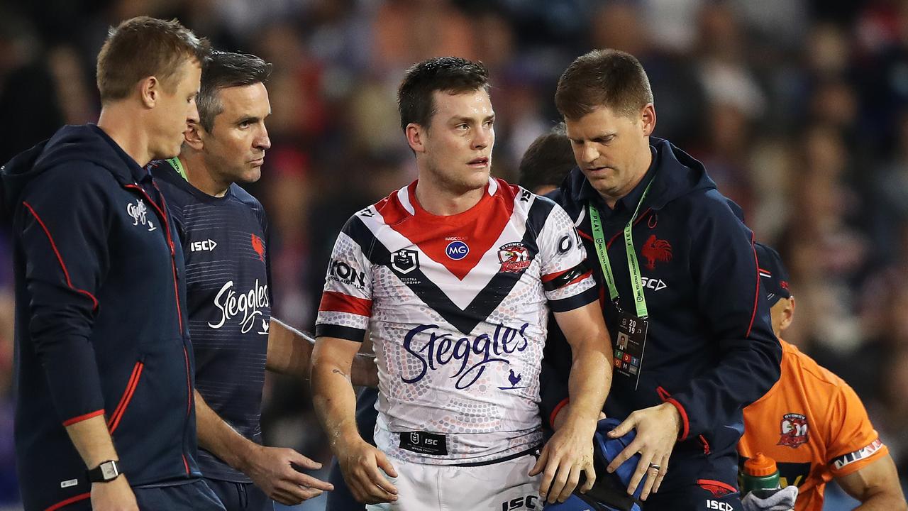 Luke Keary leaves the field after a head knock suffered against the Knights.