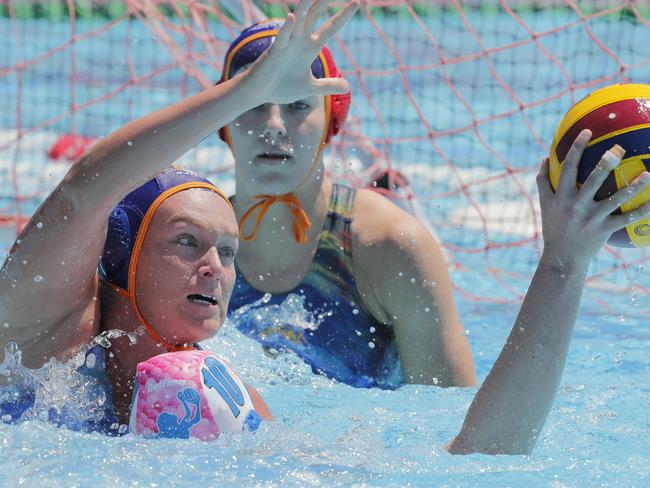 Sam Firrell (left) of Gold Coast challenges Pippa Pedley of Mermaids during the womenÃs competition in the Defina Queensland Premier League Water Polo held at the Southport Aquatic Centre, Gold Coast, October 15, 2023. Photo: Regi Varghese