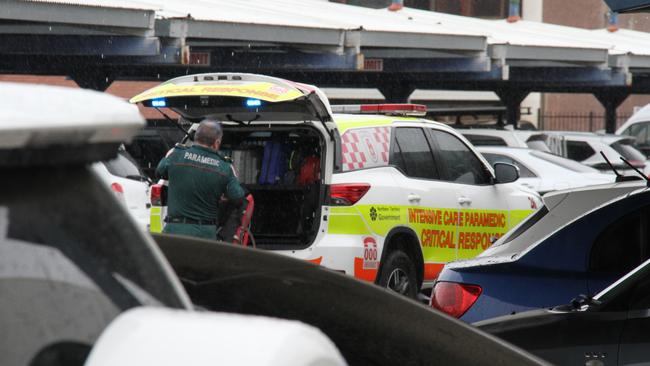 A paramedic outside Coles in Alice Springs. A man has died inside Alice Springs Coles on May 27, 2025, with police saying he was in custody at the time. Picture: Gera Kazakov