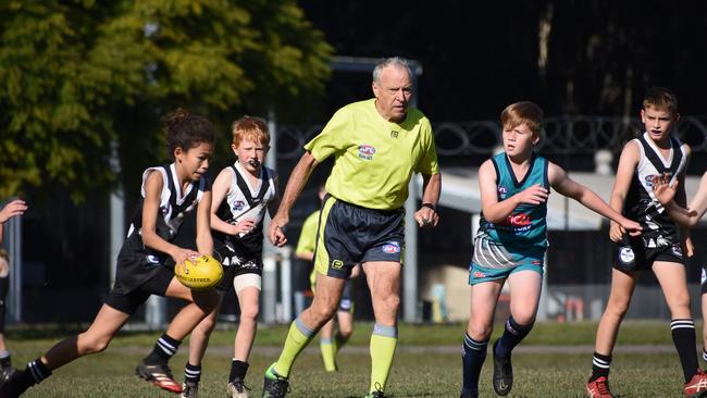 Hal Pearce has picked up the whistle and is umpiring AFL North Coast matches at the age of 74. Photo: Green Shoots Marketing.