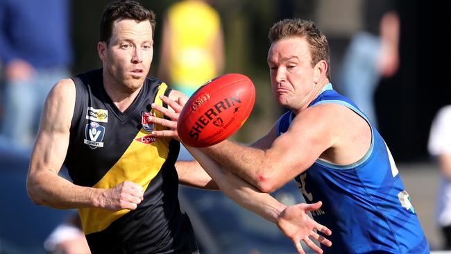 Torquay’s James Saker and Barwon Heads’ Mitch Herbison clash in the 2019 Bellarine grand final. Picture: Mike Dugdale