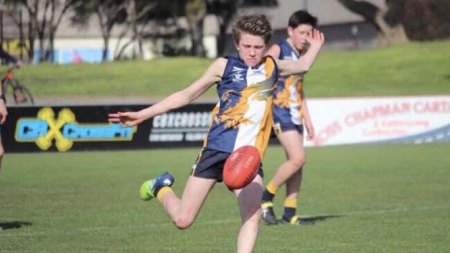 Willem Duursma takes a kick for Inverloch-Kongwak.