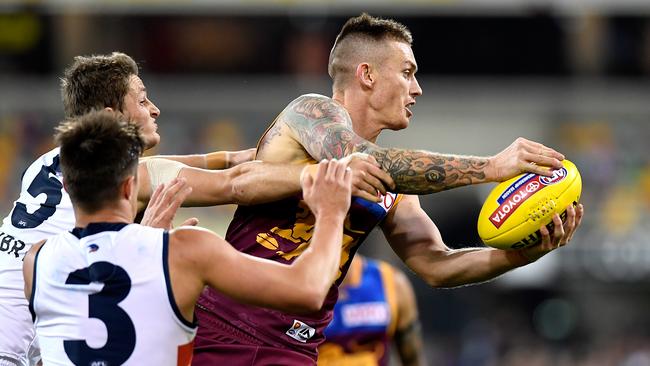 Dayne Beams under pressure from Riley Knight and Matt Crouch on Saturday. Picture: Bradley Kanaris/Getty Images