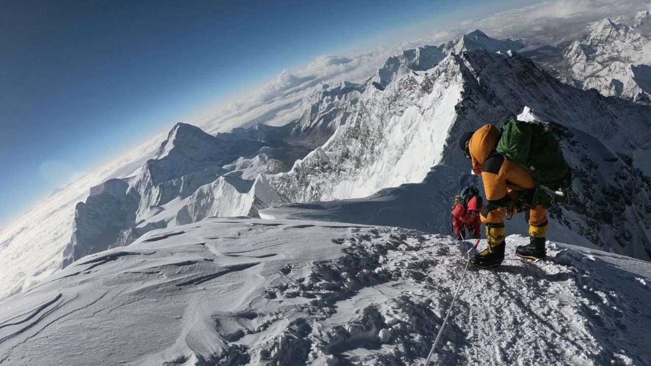 Mountaineers make their way to the summit of Mount Everest, as they ascend on the south face from Nepal. Picture: PHUNJO LAMA/AFP via Getty Images