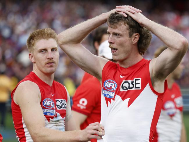 MELBOURNE, AUSTRALIA - SEPTEMBER 28: Matt Roberts and Nick Blakey of the Swans look dejected after the AFL Grand Final match between Sydney Swans and Brisbane Lions at Melbourne Cricket Ground, on September 28, 2024, in Melbourne, Australia. (Photo by Daniel Pockett/AFL Photos/Getty Images)