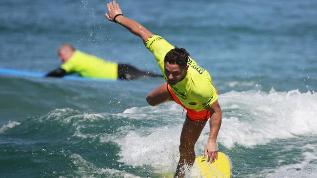 Guarnaccio, who has also appeared on the British version of Celebrity Big Brother, managed to stand up on his board thanks to instructors from Manly Surf School. Picture: Braden Fastier