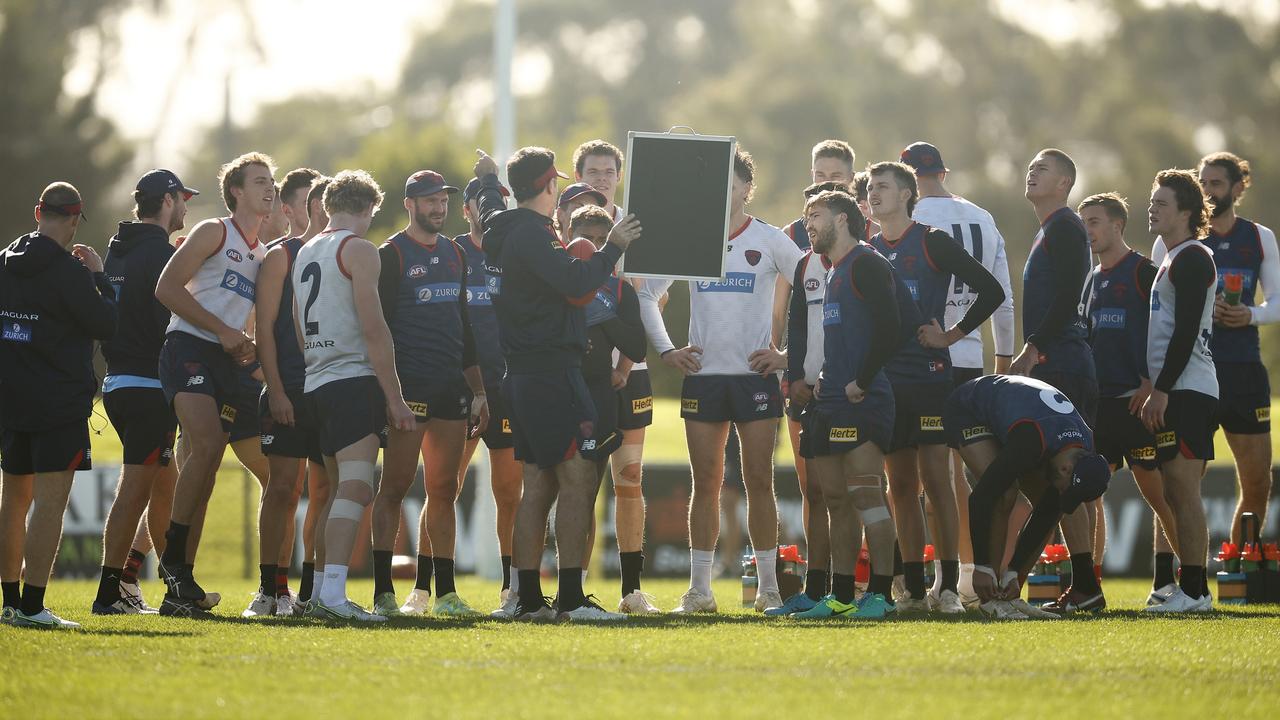 Demons players listen to instructions at Casey Fields. Picture: Daniel Pockett/Getty Images