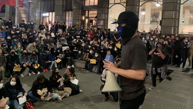 Pro-Hong Kong protesters covered their faces to hide their identities. Picture: Campbell Gellie