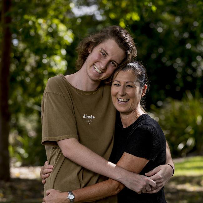 Elliott, 22, with his mother, Julie Cox in February 2020 before his double lung transplant. Picture: Jerad Williams