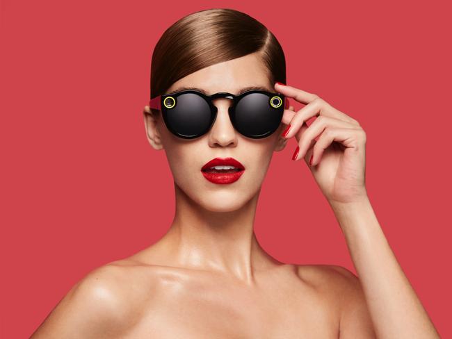 This undated image courtesy of Snap Inc. shows the company's Spectacles video-catching sunglasses. Snapchat announced on September 24, 2016, it will launch a line of sunglasses, a spin on Glass eyewear abandoned by Google more than a year ago. The California-based company said in an online post that its Spectacles will be "available soon," with media reports pegging the price at $130 a pair.  / AFP PHOTO / Snap Inc. / HO / RESTRICTED TO EDITORIAL USE - MANDATORY CREDIT "AFP PHOTO / SNAP INC." - NO MARKETING NO ADVERTISING CAMPAIGNS - DISTRIBUTED AS A SERVICE TO CLIENTS