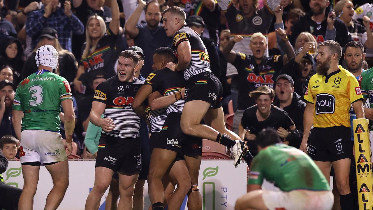 Charlie Staines of the Panthers celebrates with teammates after scoring a try.