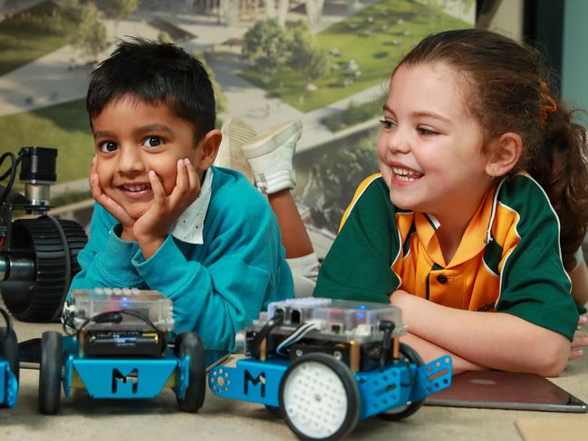 Serhan Sadiq Gandhi, 4, and Ariana Bousimon, 5, playing with Robots, at the Parramatta Powerhouse Community Space, in Parramatta Square, today. Picture:Justin Lloyd