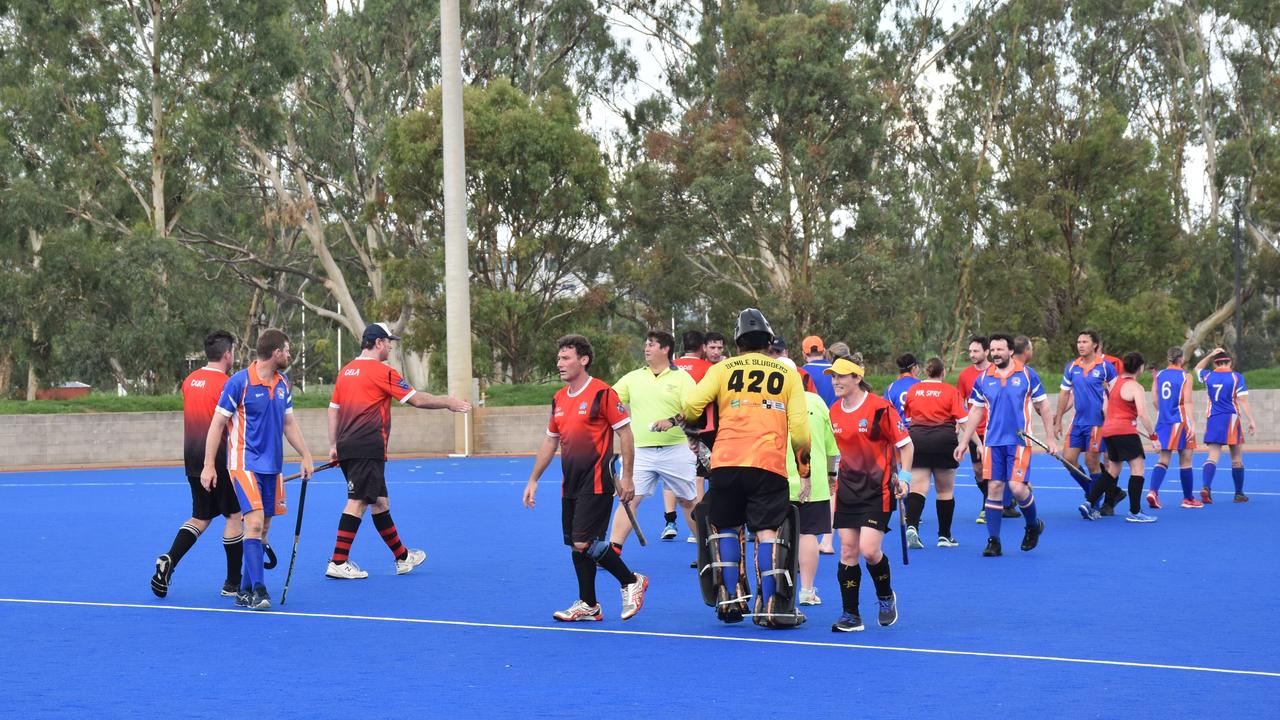 Players shake hands after a hot but successful Condy Vets carnival.