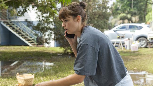 Lara Bell began the clean up on Wednesday as flood waters receded in Lismore Picture: Media-Mode