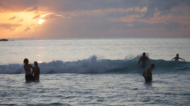 Sydneysiders take to the ocean as the sun rises on a new year. Picture: NewsWire / Christian Gilles. Picture: NewsWire / Christian Gilles