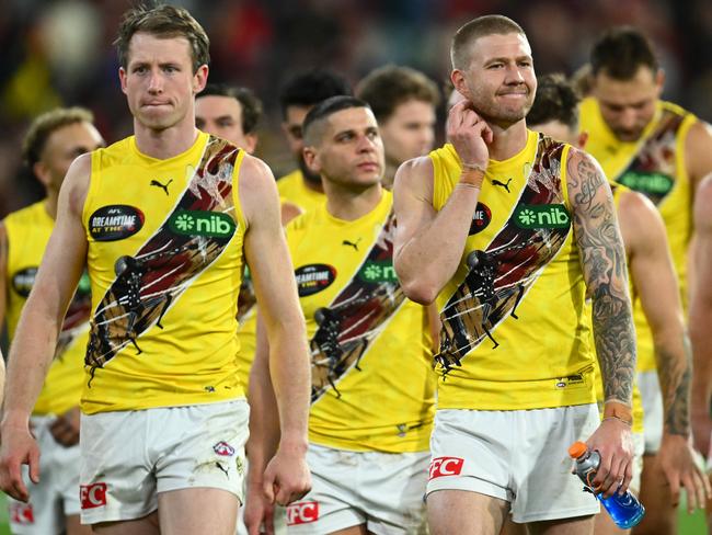 MELBOURNE, AUSTRALIA - MAY 20: Dylan Grimes and his Tigers  team mates look dejected after losing the round 10 AFL match between Essendon Bombers and Richmond Tigers at Melbourne Cricket Ground, on May 20, 2023, in Melbourne, Australia. (Photo by Quinn Rooney/Getty Images)