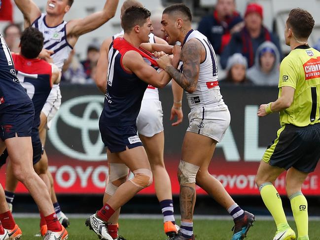 MELBOURNE, AUSTRALIA - JUNE 22: Jay Lockhart of the Demons and Michael Walters of the Dockers clash during the 2019 AFL round 14 match between the Melbourne Demons and the Fremantle Dockers at the Melbourne Cricket Ground on June 22, 2019 in Melbourne, Australia. (Photo by Michael Willson/AFL Photos via Getty Images)