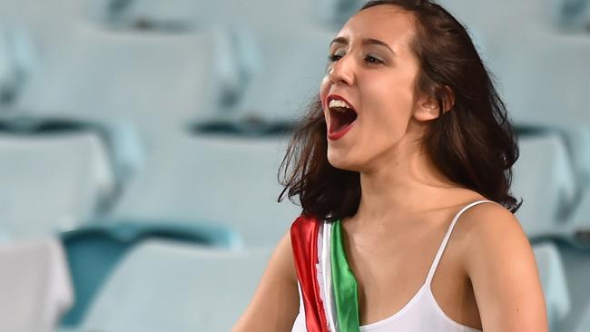 (FILES) This file photo taken on January 15, 2015 shows a fan of Iran cheering during their game against Qatar in their Group C football match in the AFC Asian Cup in Sydney. Iran's footballers have been warned they could face punishment if they take "selfie" pictures with female fans who have turned out in large numbers at the Asian Cup. AFP PHOTO / FILES / Peter PARKS --IMAGE RESTRICTED TO EDITORIAL USE - STRICTLY NO COMMERCIAL USE