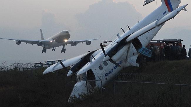 Poor record ... Nepal has suffered a number of air crashes in recent years. Here, a Nepal Airways Twin Otter aircraft (R) lie...