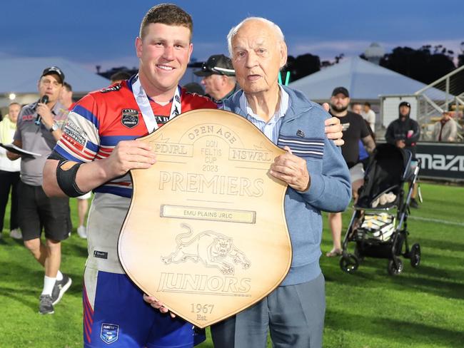 Thomas Romer captain for Emu Plains holds the Don Feltis Shield with Don Feltis, Open Menâs Division 1, Penrith and District Junior Rugby League, grand final, Emu Plains v Windsor Wolves , 2023. Picture: Steve Montgomery