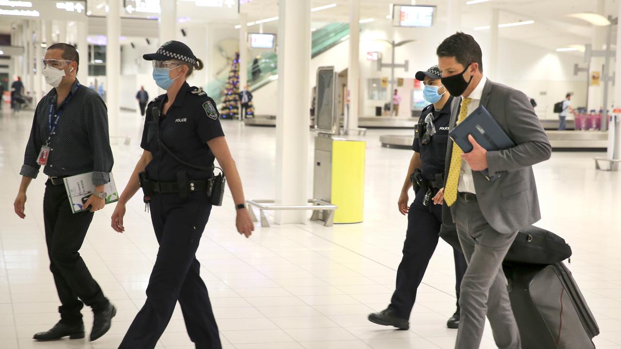 Senator Alex Antic is escorted through Adelaide Airport by police on December 2. Picture Dean Martin