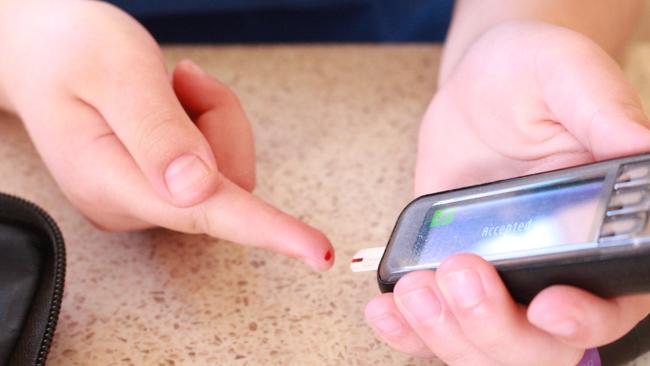 A child’s blood glucose level is monitored. Diabetes Australia is calling for a national hospital diabetes audit to ascertain how many people are coming into the hospital system with diabetes-related complications. Picture: Marian Faa