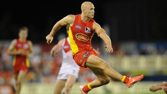 GOLD COAST, AUSTRALIA - JUNE 08: Gary Ablett of the Suns kicks the ball during the round 12 AFL match between the Gold Coast Suns and Sydney Swans at Metricon Stadium on June 8, 2014 on the Gold Coast, Australia. (Photo by Matt Roberts/Getty Images)