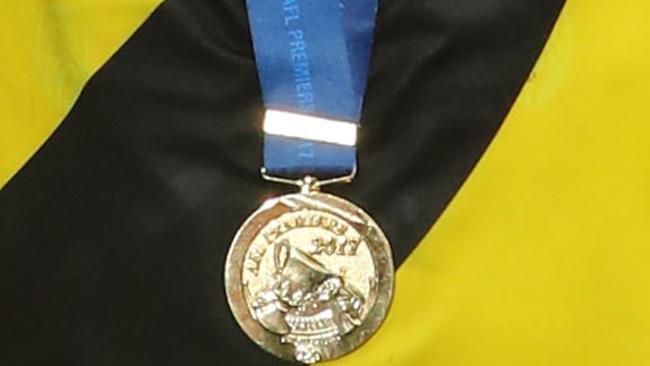 A Richmond play wears the 2017 Grand Final Medal