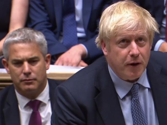 A video grab from footage broadcast by the UK Parliament's Parliamentary Recording Unit (PRU) shows Britain's Prime Minister Boris Johnson as he  speaks to move a motion to hold an early parliamentary general election, in the House of Commons in London on September 4, 2019. - British Prime Minister Boris Johnson on Wednesday called for parliament to vote in favour of holding early elections after MPs dealt a major blow against his Brexit strategy. (Photo by - / PRU / AFP) / RESTRICTED TO EDITORIAL USE - MANDATORY CREDIT " AFP PHOTO / PRU " - NO USE FOR ENTERTAINMENT, SATIRICAL, MARKETING OR ADVERTISING CAMPAIGNS - EDITORS NOTE THE IMAGE HAS BEEN DIGITALLY ALTERED AT SOURCE TO OBSCURE VISIBLE DOCUMENTS