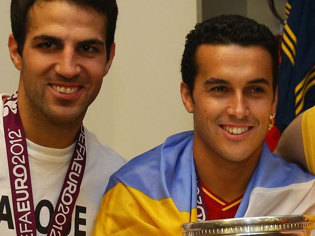 KIEV, UKRAINE - JULY 01: (L-R) Cesc Fabregas, Pedro and Victor Valdes of Spain pose with the trophy in the dressing room following the UEFA EURO 2012 final match between Spain and Italy at the Olympic Stadium on July 1, 2012 in Kiev, Ukraine. (Photo by Handout/UEFA via Getty Images)