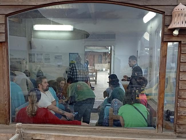 Survivors rest at a coffee shop in Marsa Alam, Egypt. Picture: AP