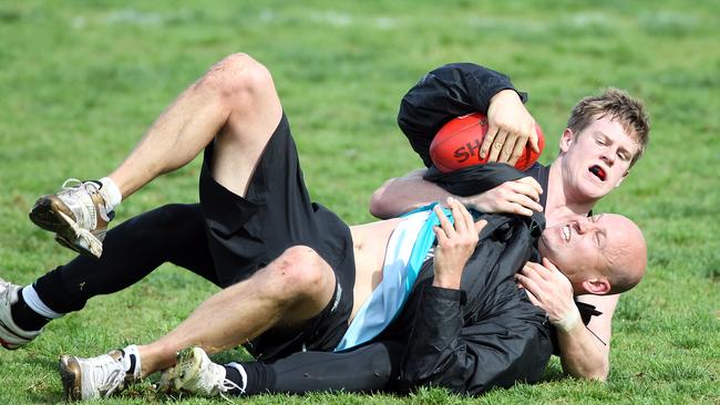 Tom Jonas battles Crows coach Matthew Nicks, then a Power assistant, during the 2011 season.