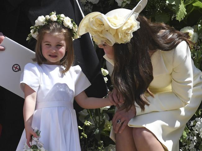 Catherine, Duchess of Cambridge talks to Charlotte at the wedding of Prince Harry and Meghan Markle. Picture: Ben Cawthra/Sipa USA/MEGA