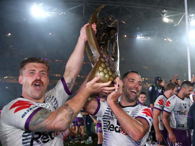 Cameron Munster of the Storm and Cameron Smith of the Storm pose with the Premiership trophy after winning the 2020 NRL Grand Final match between the Penrith Panthers and the Melbourne Storm at ANZ Stadium on October 25, 2020 in Sydney, Australia. (Photo by Cameron Spencer/Getty Images)